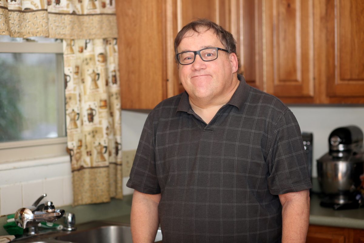 Autism and learning disabled man performs different tasks around the home.