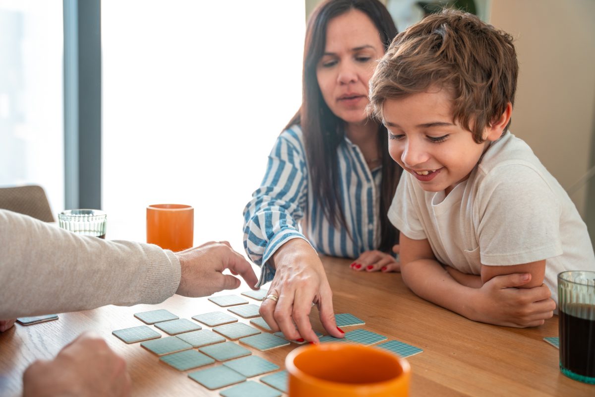 child learning to match with a matching game during therapy